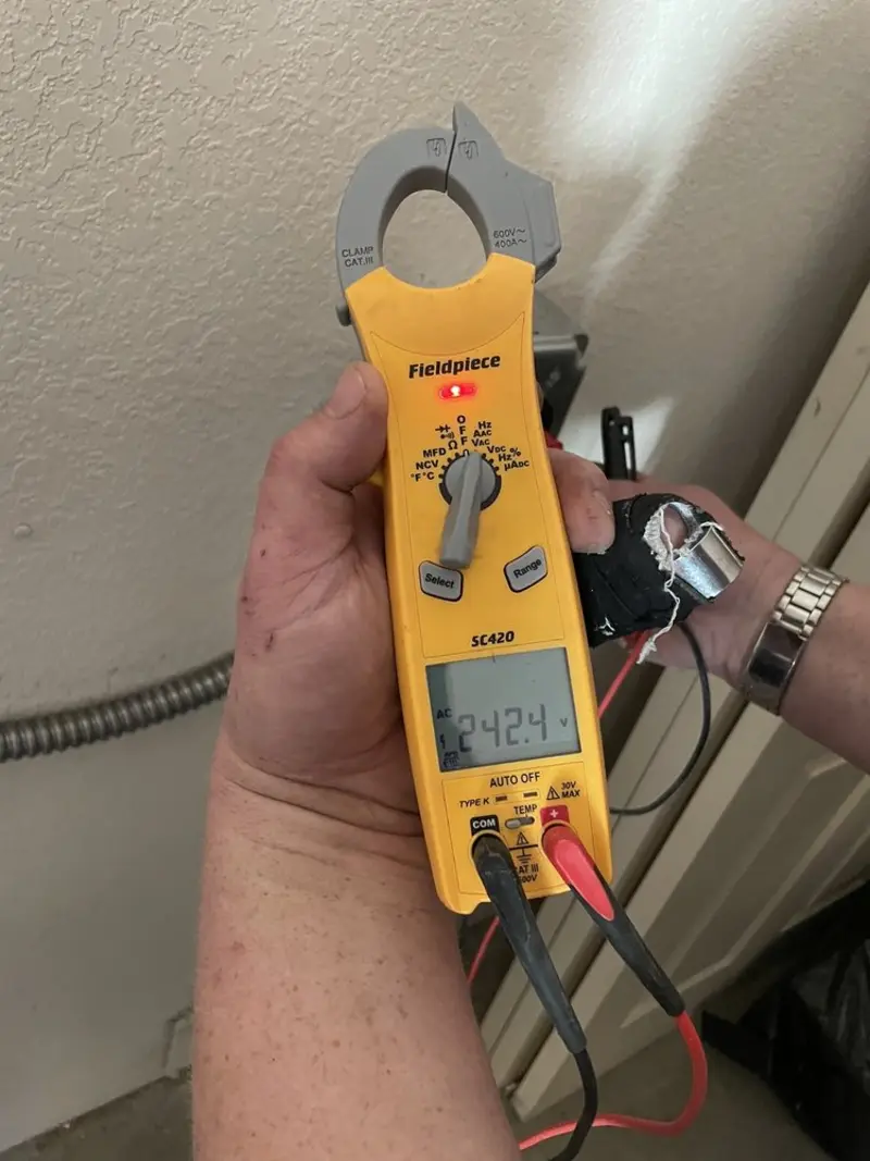 Voltage testing with clamp meter during Recessed Lighting Installation in Haleyville